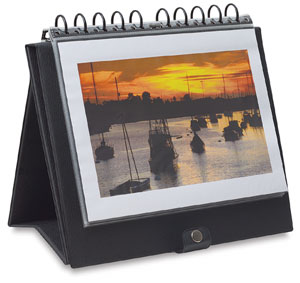 These traditional pyramid-style, landscape easel binders feature laminated vinyl covers with a black grain finish, snap closure, and a handle on the spine. They include 10 transparent, archival, acid-free polypropylene pages with black paper inserts.
